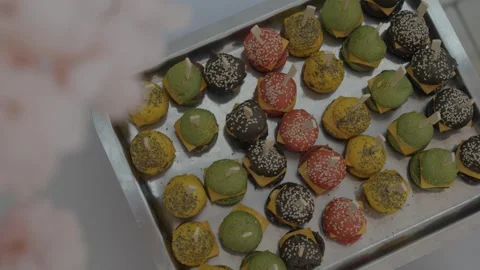 High-Angle Close-up of Colorful Mini Slider Hamburgers on Catering Platter Stock Footage 342290399