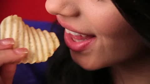 High Angle Close Lips Beautiful Brunette Woman Model Eat Potato Chip Snack Food Stock Footage 22410545