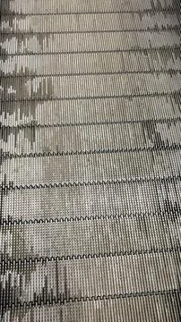 High angle close-up of metallic escalator steps with a repeating industrial.. Stock Photos