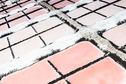 High-angle close-up of pink salt evaporation pans at Salinas de Fuencalient.. Stock Photos