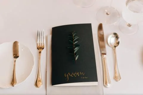 High angle close up of place setting at a wedding table, with black name card Stock Photos