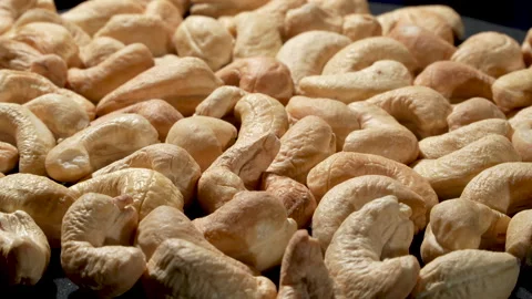 High Angle Close-up of Roasted Cashews Rotating Full Frame. Stockbeeldmateriaal 332839403