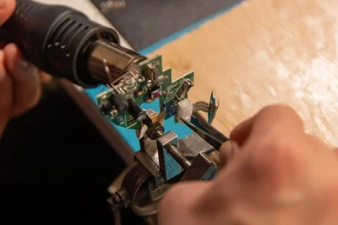 This high-angle close-up shot captures an electronics technician or engineer  Stock Photos