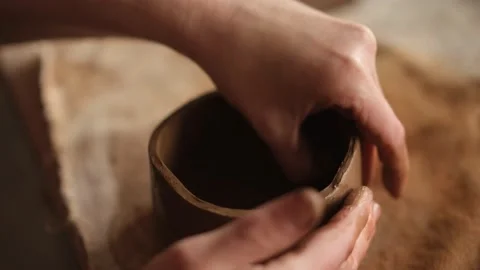 High angle close up shot of ceramic artist sculpting a bowl in the studio Stock Footage 236329211
