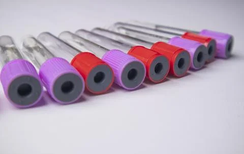 High-angle, close-up shot of eight empty medical blood collection tubes wit.. Stock Photos