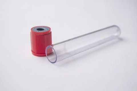 High-angle, close-up shot of an empty medical blood collection tube lying h.. Stock Photos