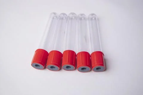 High-angle, close-up shot of five empty medical blood collection tubes with.. Stock Photos