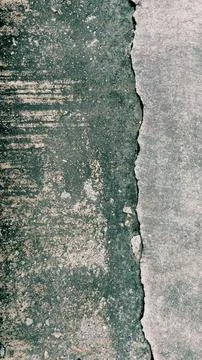 A high-angle, close-up shot showing a significant split and deep crack. Stock Photos