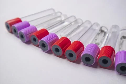 High-angle, close-up shot of ten empty medical blood collection tubes with .. Stock Photos