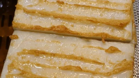 High-Angle Close-up of Sliced Traditional Korean Fish Cake (Eomuk) with Toasted Stock Footage 337373148