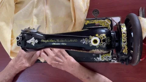 High Angle Close-up Of Stitching Zipper With Vintage Sewing Machine Stock Footage 331996226