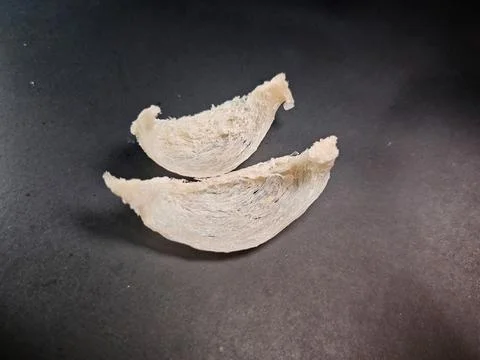 High Angle Close Up of Two Premium Edible Bird's Nests on Black Stock Photos