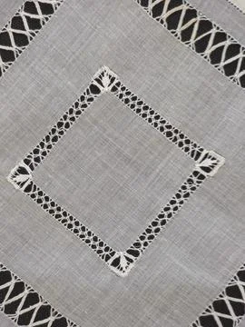 High-angle close-up view of delicate handcrafted drawn thread openwork embroi Stock-Fotos