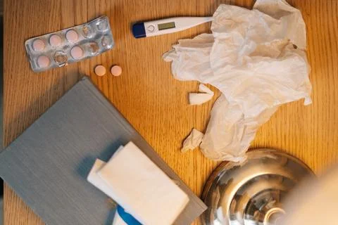 High-angle close-up view of home sickness medical supplies lying on bedside Stock Photos