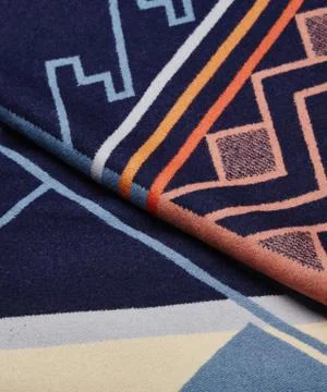 High angle closeup shot of a carpet with colorful patterns Fotos de archivo