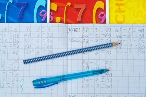 High angle closeup shot of notebook with math exercises, pen and pencil, Stock Photos