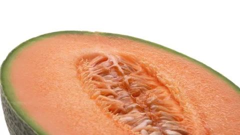High angle closeup view of half of cantaloupe melon rotating. Isolated on white Stock-Footage 169844968