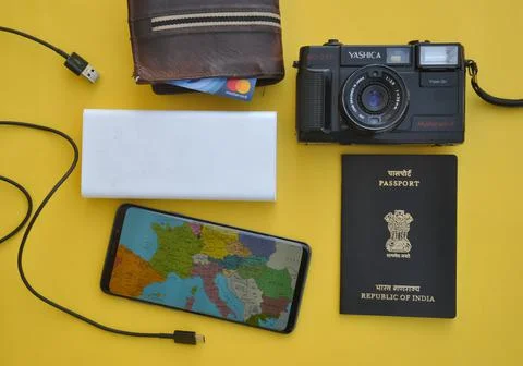 High angle of collecting essential things of travel for international traveling Stock Photos