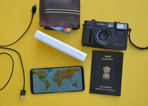 High angle of collecting essential things of travel for international traveling Stock Photos