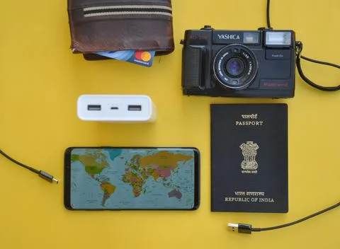 High angle of collecting essential things of travel for international traveling Stock Photos