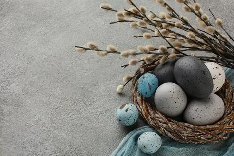 High angle colored easter eggs basket with copy space twigs. High quality b.. 写真素材