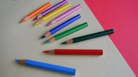 High angle of colorful sharp pencils on a sheet of paper with space for text Stock Photos