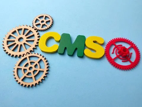 A high-angle conceptual flat lay featuring the acronym CMS Content Manageme.. 写真素材