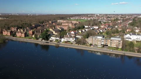 HIGH ANGLE CRANE DOWN SHOT OF A POND OF BIRDS IN EAST LONDON, UK Video stock 150153586