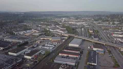 A High Angle Dolly Shot of Mixed Commercial/ Industrial Cityscape Stock Footage 89874931
