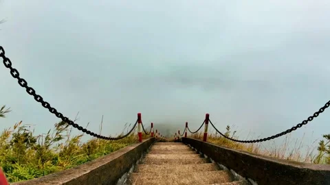 High angle downward drone view of rolling clouds from mountain crest 4K Stock Footage 337332289