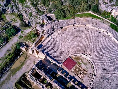 High angle drone aerial view of ancient greek rock cut lykian empire amphithe Stock Photos