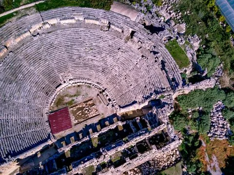 High angle drone aerial view of ancient greek rock cut lykian empire amphithe Stock Photos