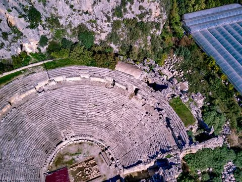 High angle drone aerial view of ancient greek rock cut lykian empire amphithe Stock Photos