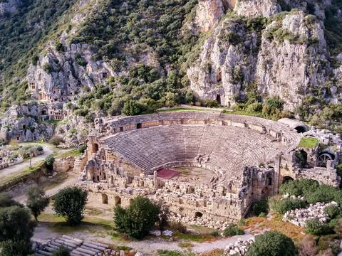High angle drone aerial view of ancient greek rock cut lykian empire amphithe Stock Photos