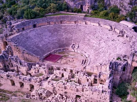 High angle drone aerial view of ancient greek rock cut lykian empire amphithe Stock Photos