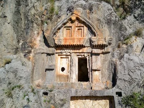 High angle drone aerial view of ancient greek rock cut tombs carved into clif Stock Photos