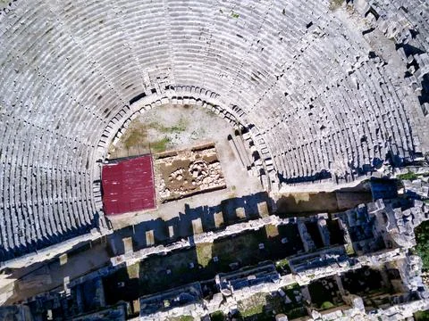 High angle drone aerial view of ancient greek rock cut lykian empire amphithe Stock Photos
