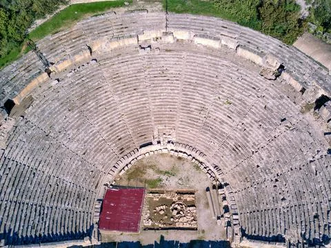 High angle drone aerial view of ancient greek rock cut lykian empire amphithe Stock Photos