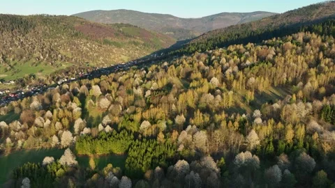 High angle drone flight over rolling green hills and rural countryside of Z.. Stock Footage 335475194