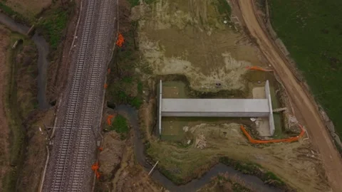 High-angle drone footage of a completed concrete drainage tunnel designed for Stock Footage 332139814