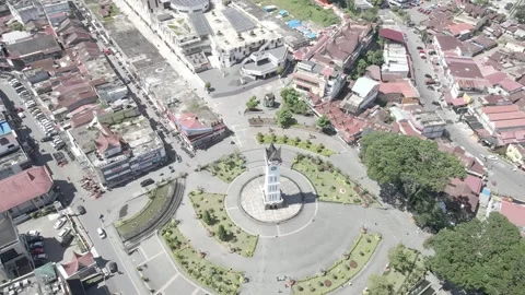 High-Angle Drone Orbit Around Jam Gadang Clock Tower and Plaza in Bukittingg Stock Footage 343198748