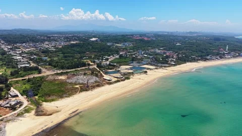 High angle drone orbit circling picturesqe fishing village by blue sea 4K Stock Footage 336652687