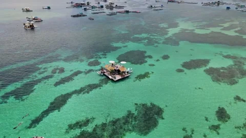 High angle drone orbit of a floating holiday dock with SUP sports 4K Stock Footage 336040101