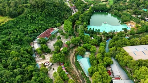 High angle drone orbit over outdoor natural thermal hot spring bath 4K Stock Footage 341551206