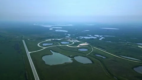 High-Angle Drone over Modern Wetland Conservation Centre in Fog Vidéo 316293100