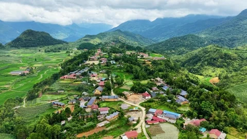 High angle drone panorama across hilltop village and terraced valleys 4K Stock Footage 341543012