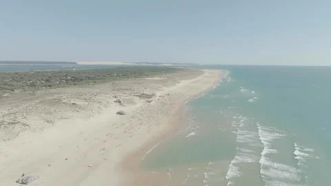 High angle drone rising over Cap Ferret with beach left and ocean right, France Stock Footage 333107562