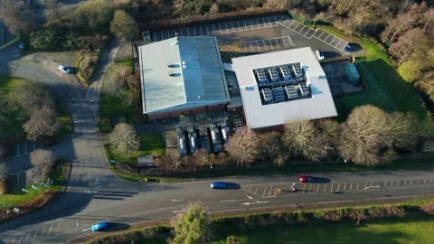 High angle drone shot of active industrial HVAC cooling units on the roof of a Stock Footage 333542621