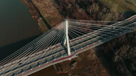 High angle drone shot of amazing white cable bridge across autumn Wisla river on Stock Footage 172337461