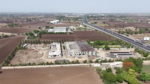 High Angle Drone Shot of Building Construction Site Infrastructure with Rural Stock Footage 344036852